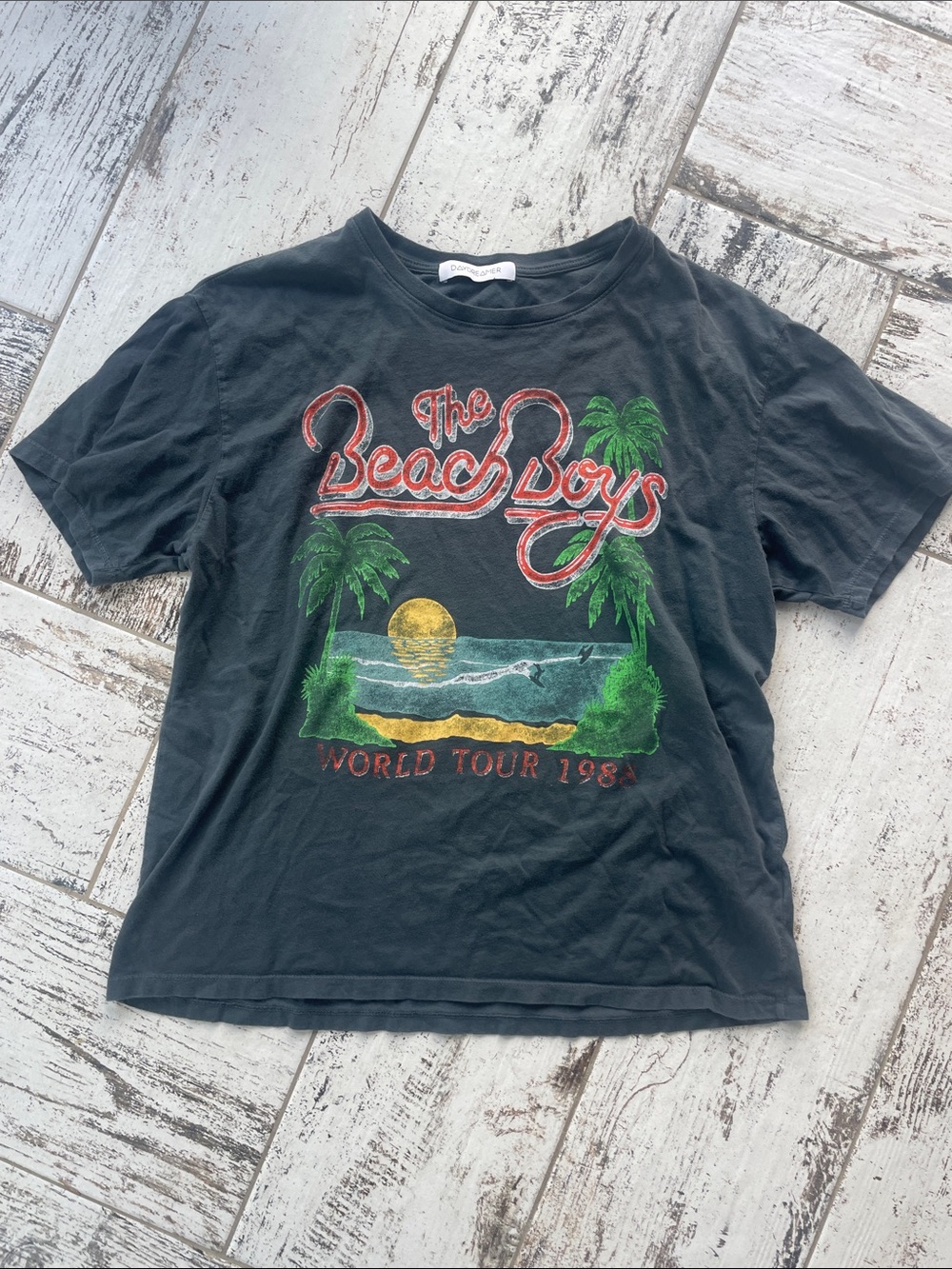 Daydreamer Black Beach Boys World Tour Graphic Tee with Green & Yellow Accents